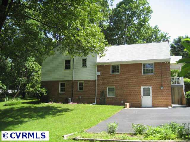 3300 Cedar Grove Road Richmond, VA 23235 - Photo 3 of 10 a front view of a house with a yard