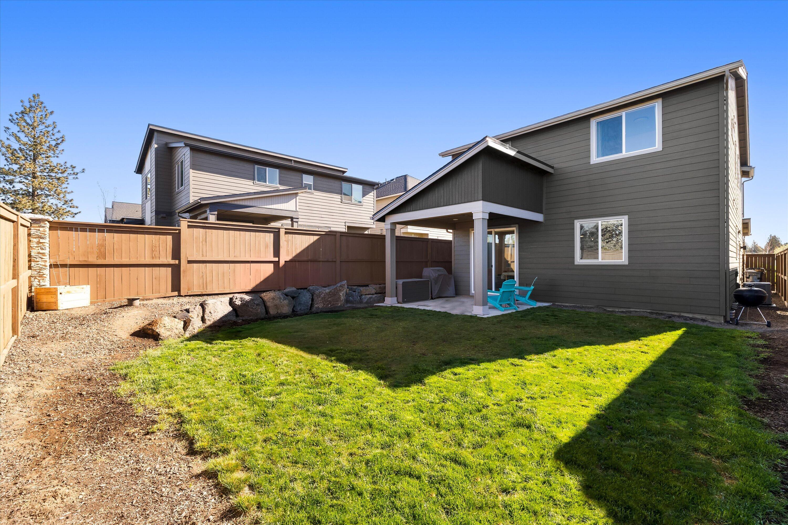60903 Southeast Epic Place Bend, OR 97702 - Photo 4 of 48 a front view of a house with garden