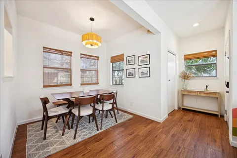 a view of a dining room with furniture window and wooden floor
