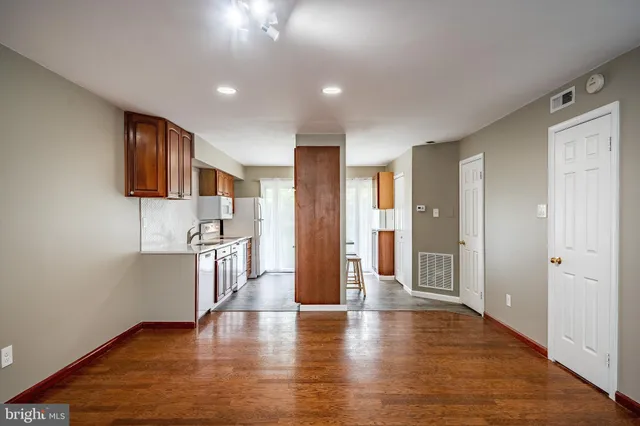 a view of a kitchen from the hallway