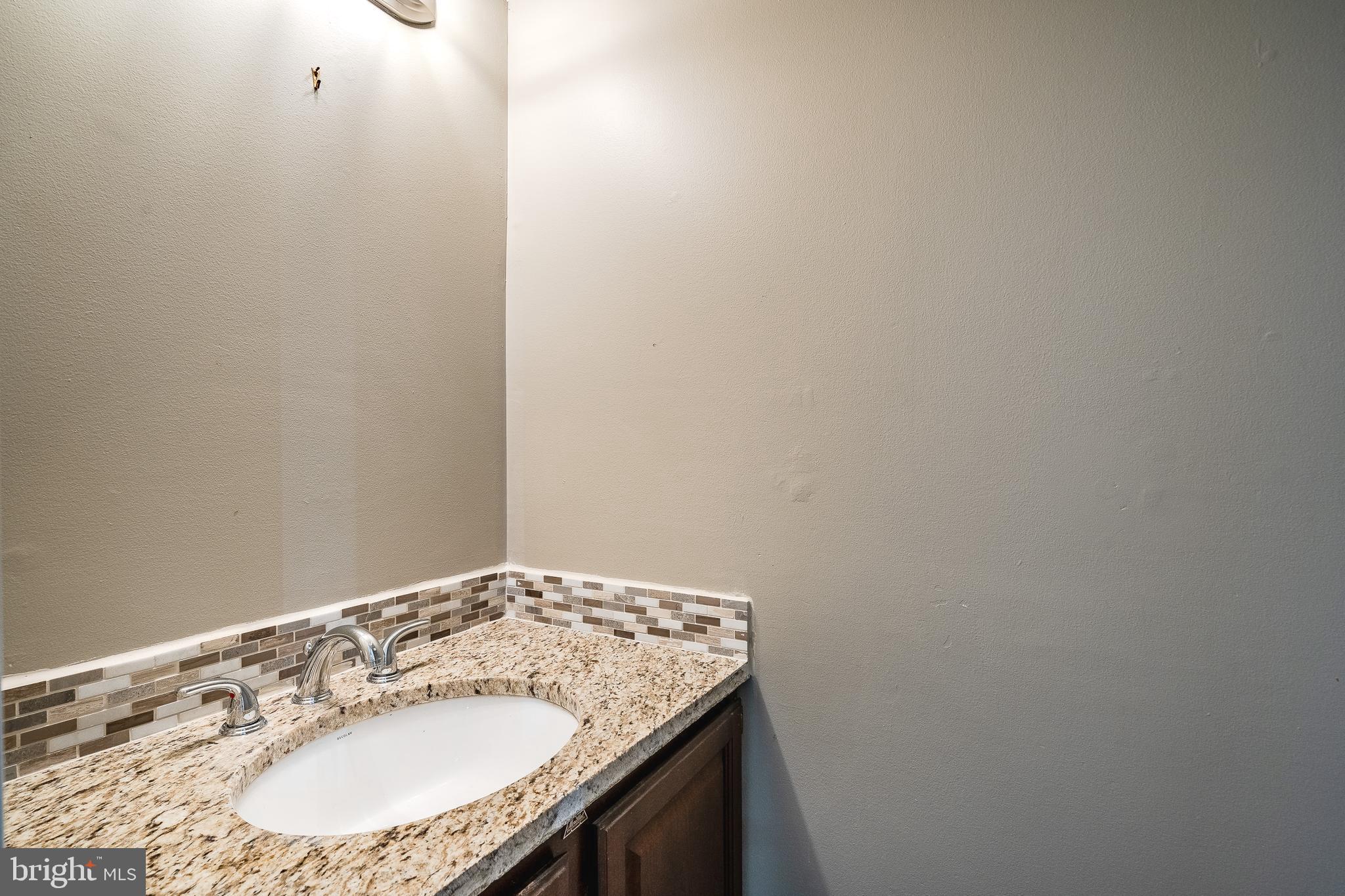314 Headhouse Court, Unit 314 Chesterbrook, PA 19087 - Photo 18 of 28 Powder room with granite counters