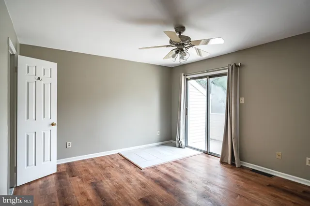 a view of a room that has a mirror in it