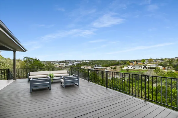 a view of roof deck with patio