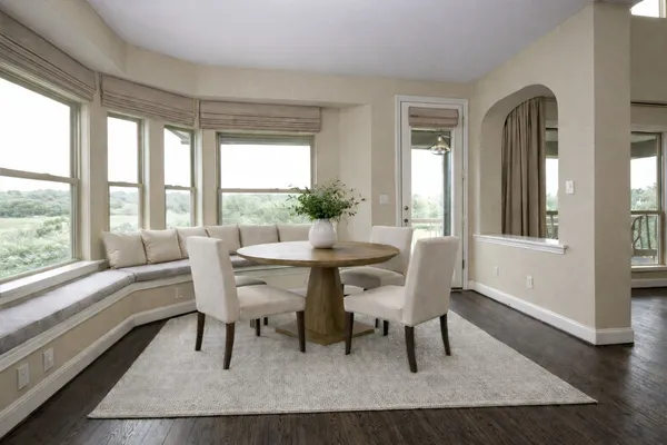 a dining room with furniture and window