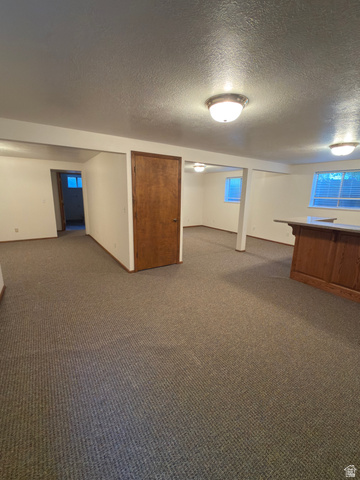1164 East Mountain Road Logan, UT 84321 - Photo 23 of 45 Expansive lower level with textured carpeting and recessed ceiling lighting