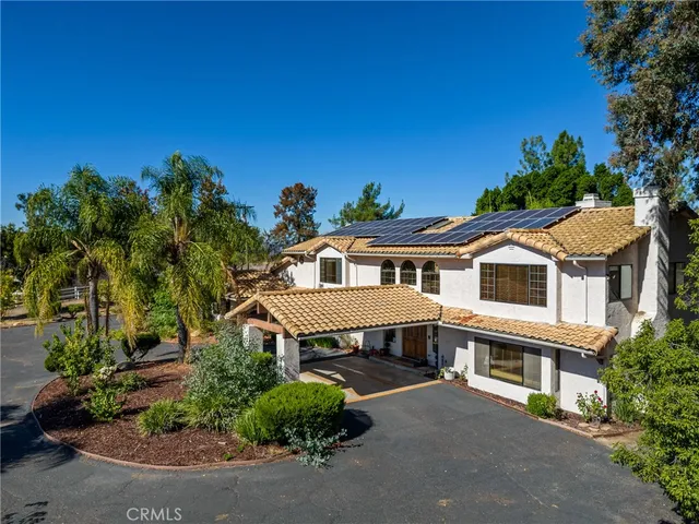 a house with trees in the background