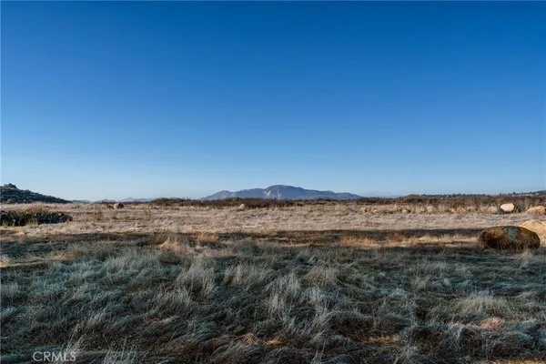 a swimming pool view with a outdoor seating