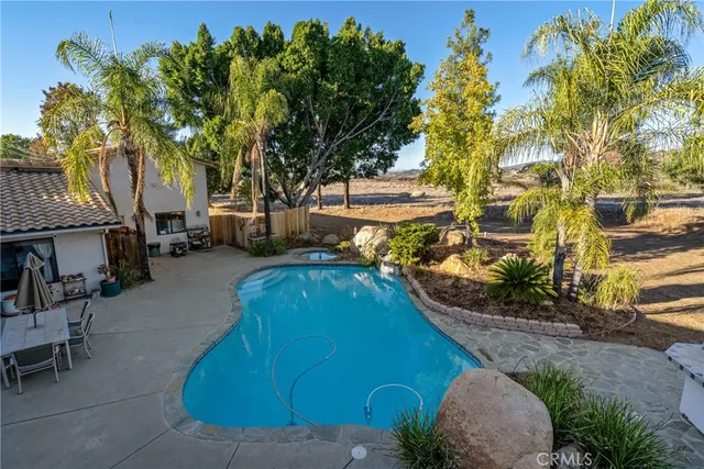 a view of a pathway with a wrought fence