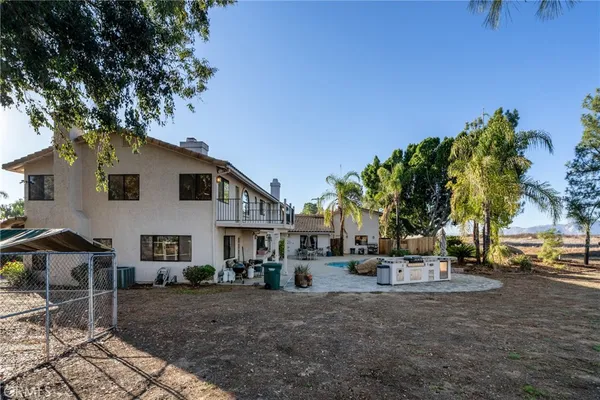 a view of an entryway with wooden floor and a chandelier