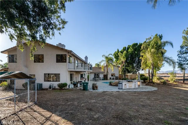 a view of an entryway with wooden floor and a chandelier