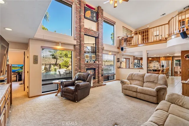 a living room with a fireplace and a flat screen tv