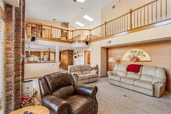 a room with furniture a flat screen tv and a fireplace