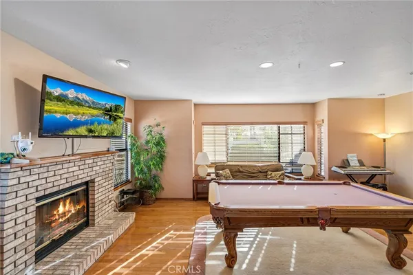 a kitchen with stainless steel appliances granite countertop a sink and a refrigerator