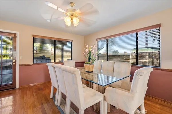 a kitchen with stainless steel appliances granite countertop a refrigerator a stove and a sink with cabinets