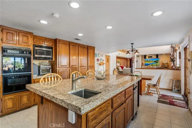 a living room with furniture cabinets and a window