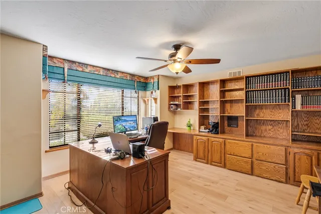 a view of living room with granite countertop furniture and a fireplace