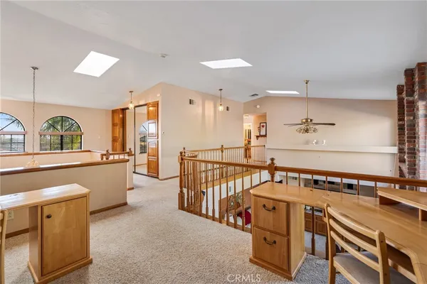 a bedroom with furniture and large window