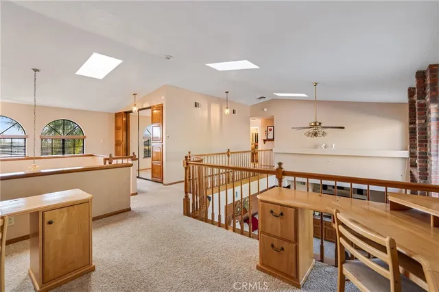 a bedroom with furniture and large window