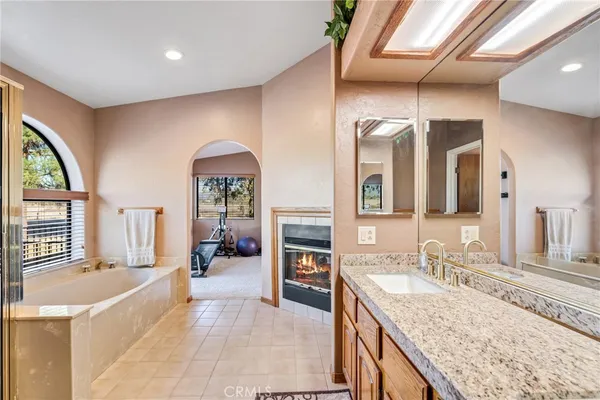 a view of a room with wooden floor and windows