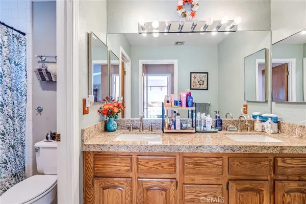 a bedroom with furniture and a chair