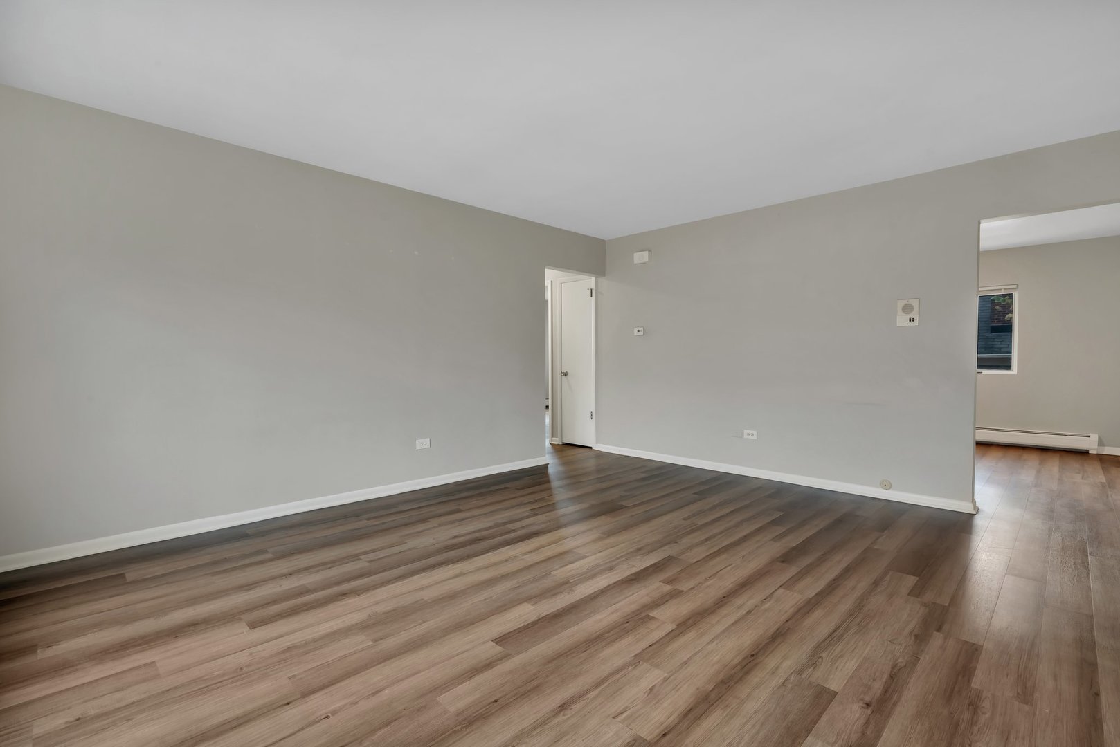 42 South Waiola Avenue, Unit 2 La Grange, IL 60525 - Photo 4 of 13 a view of an empty room with wooden floor