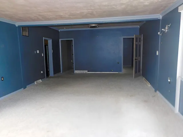 a kitchen with stainless steel appliances wooden cabinets and a stove top oven