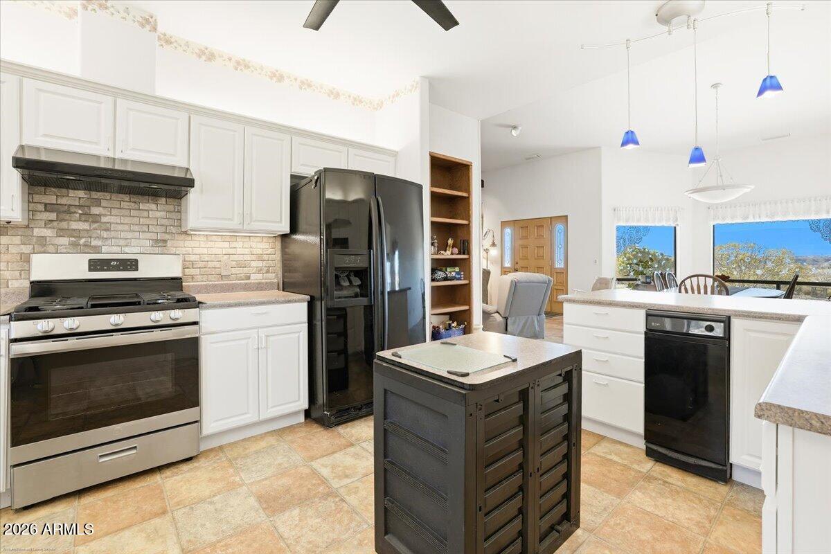 1980 Koch Ranch Road Cornville, AZ 86325 - Photo 10 of 41 a kitchen with a sink stove and refrigerator