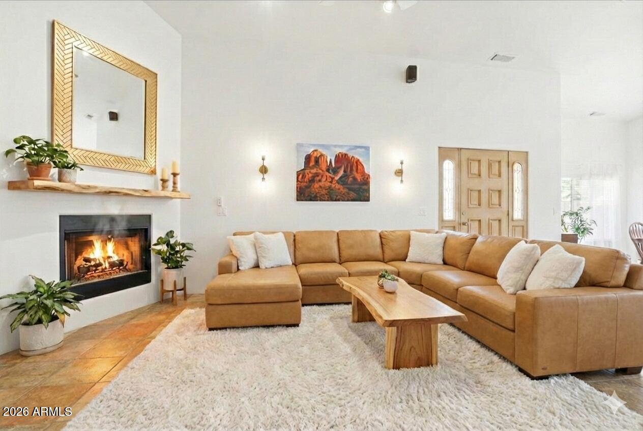 1980 Koch Ranch Road Cornville, AZ 86325 - Photo 8 of 41 a living room with furniture and a fireplace