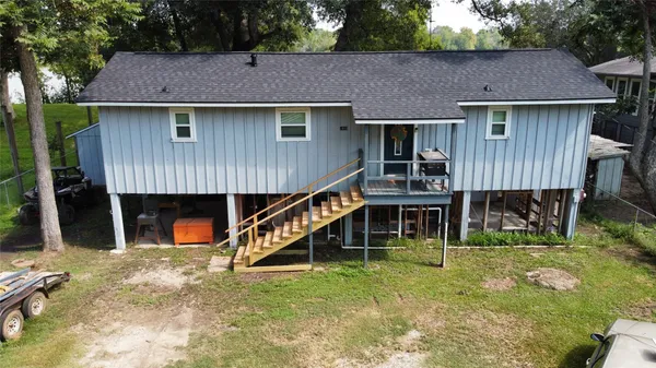 a aerial view of a house with swimming pool and porch