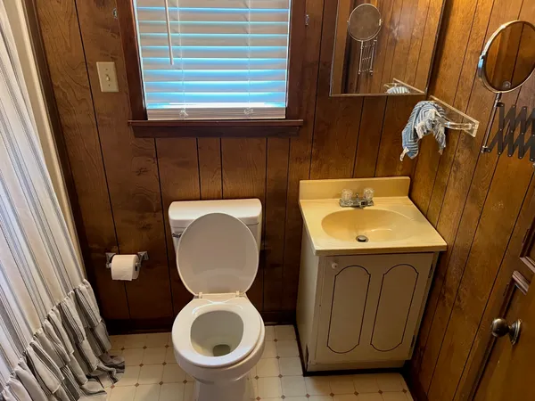 a bathroom with a toilet and a sink