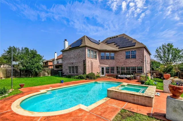 a view of yard with swimming pool and green space