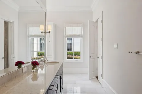 a white bath tub sitting next to a window