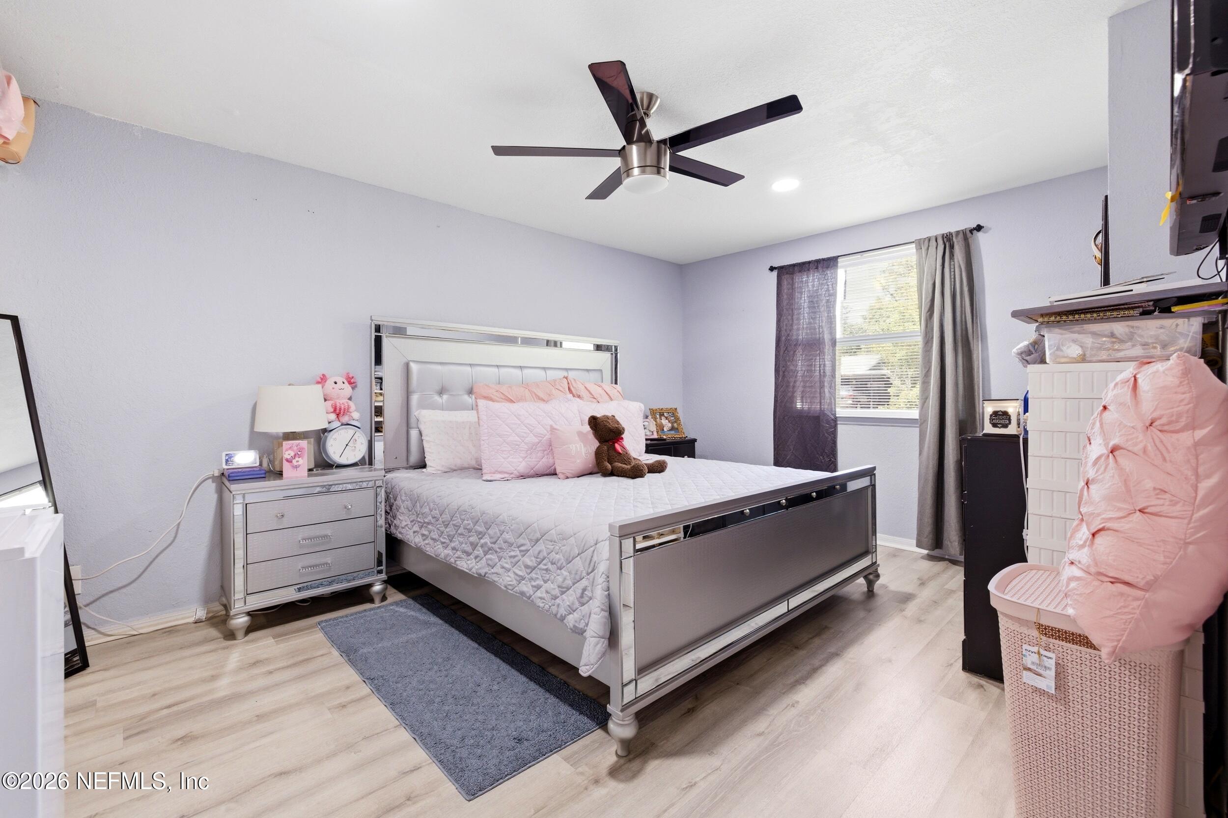 1955 Layton Road Jacksonville, FL 32211 - Photo 18 of 35 a bed room with a bed and a ceiling fan