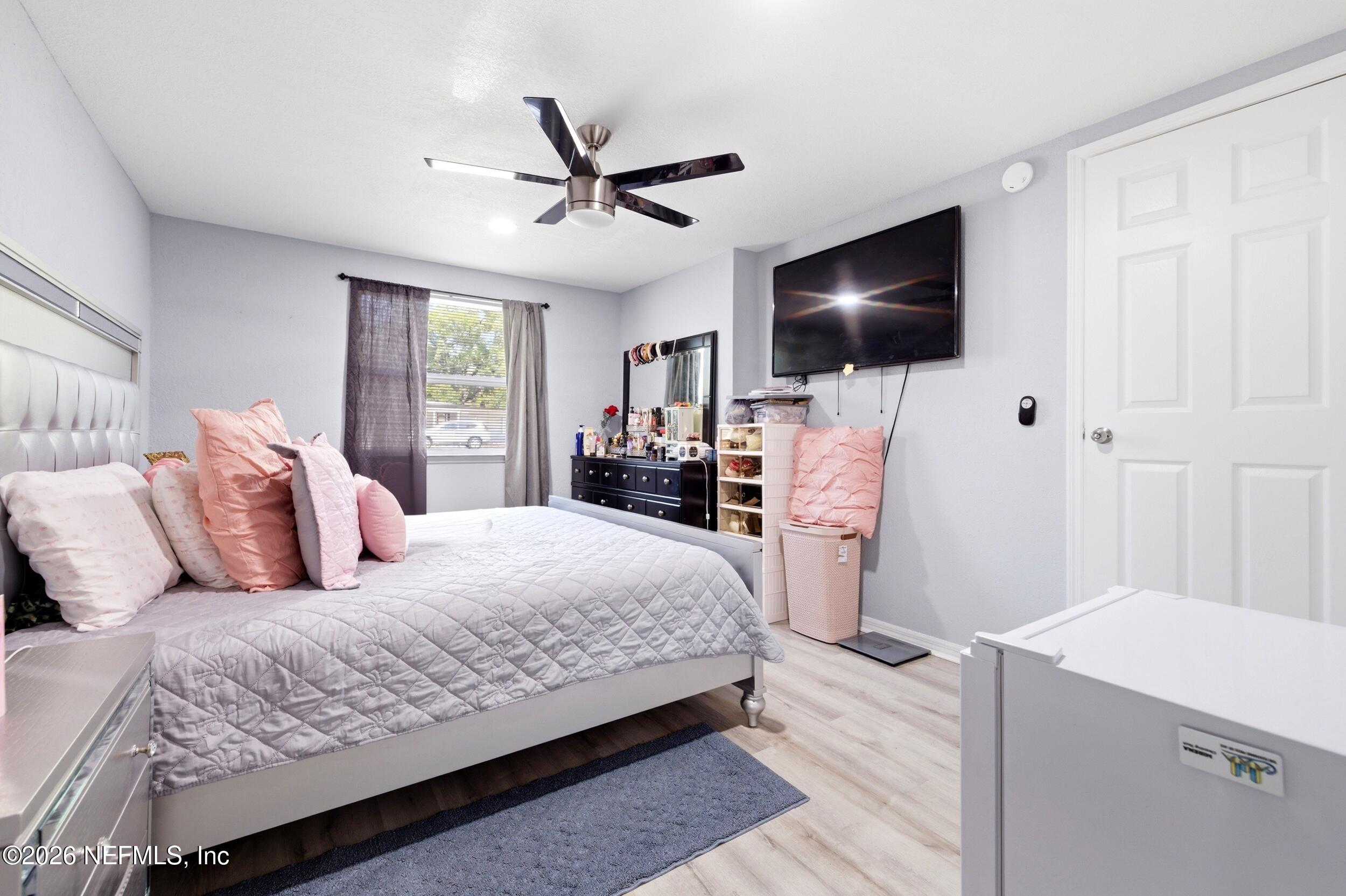 1955 Layton Road Jacksonville, FL 32211 - Photo 19 of 35 a bedroom with a large bed and a flat screen tv