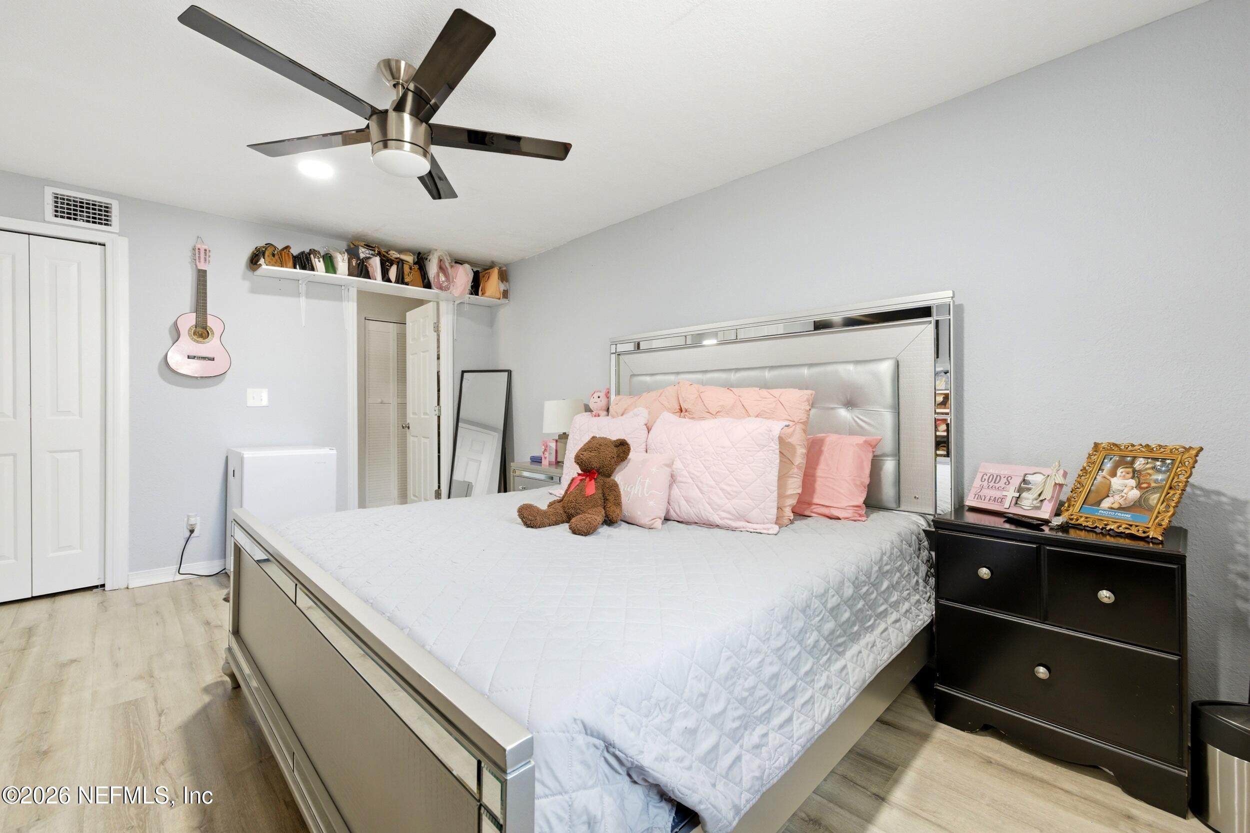 1955 Layton Road Jacksonville, FL 32211 - Photo 20 of 35 a bedroom with a bed and a dresser