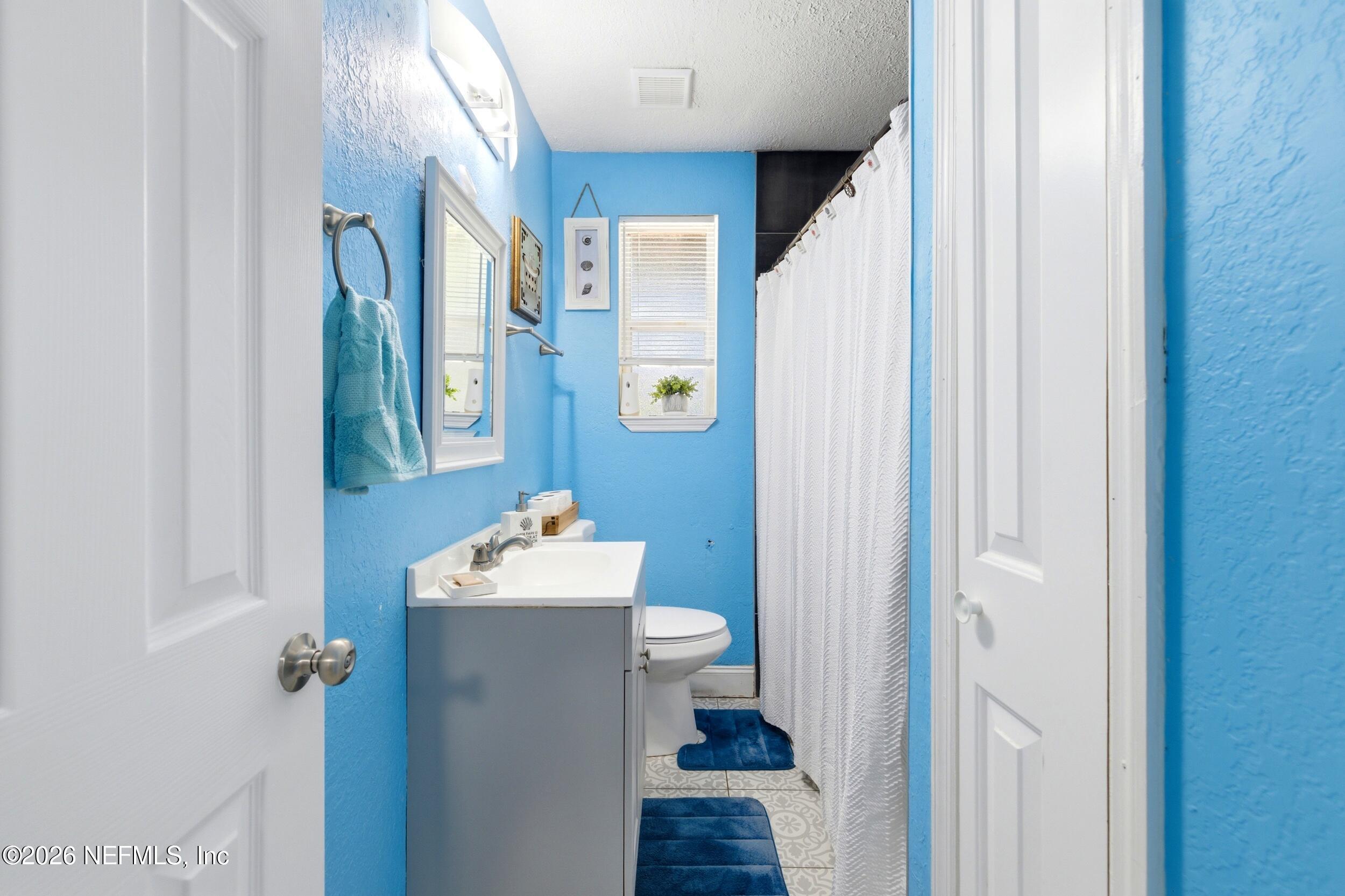 1955 Layton Road Jacksonville, FL 32211 - Photo 23 of 35 a bathroom with a sink toilet and shower