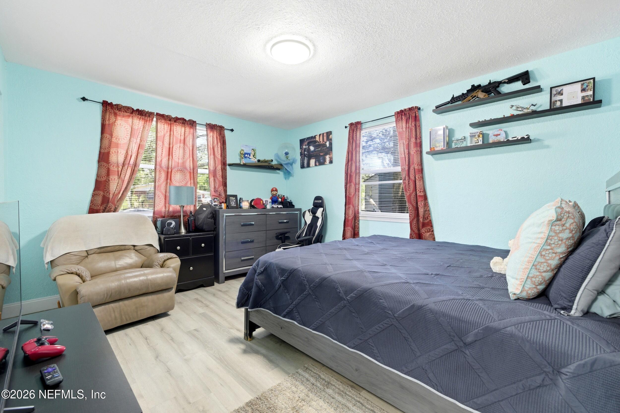 1955 Layton Road Jacksonville, FL 32211 - Photo 24 of 35 a bedroom with a bed and wooden floor
