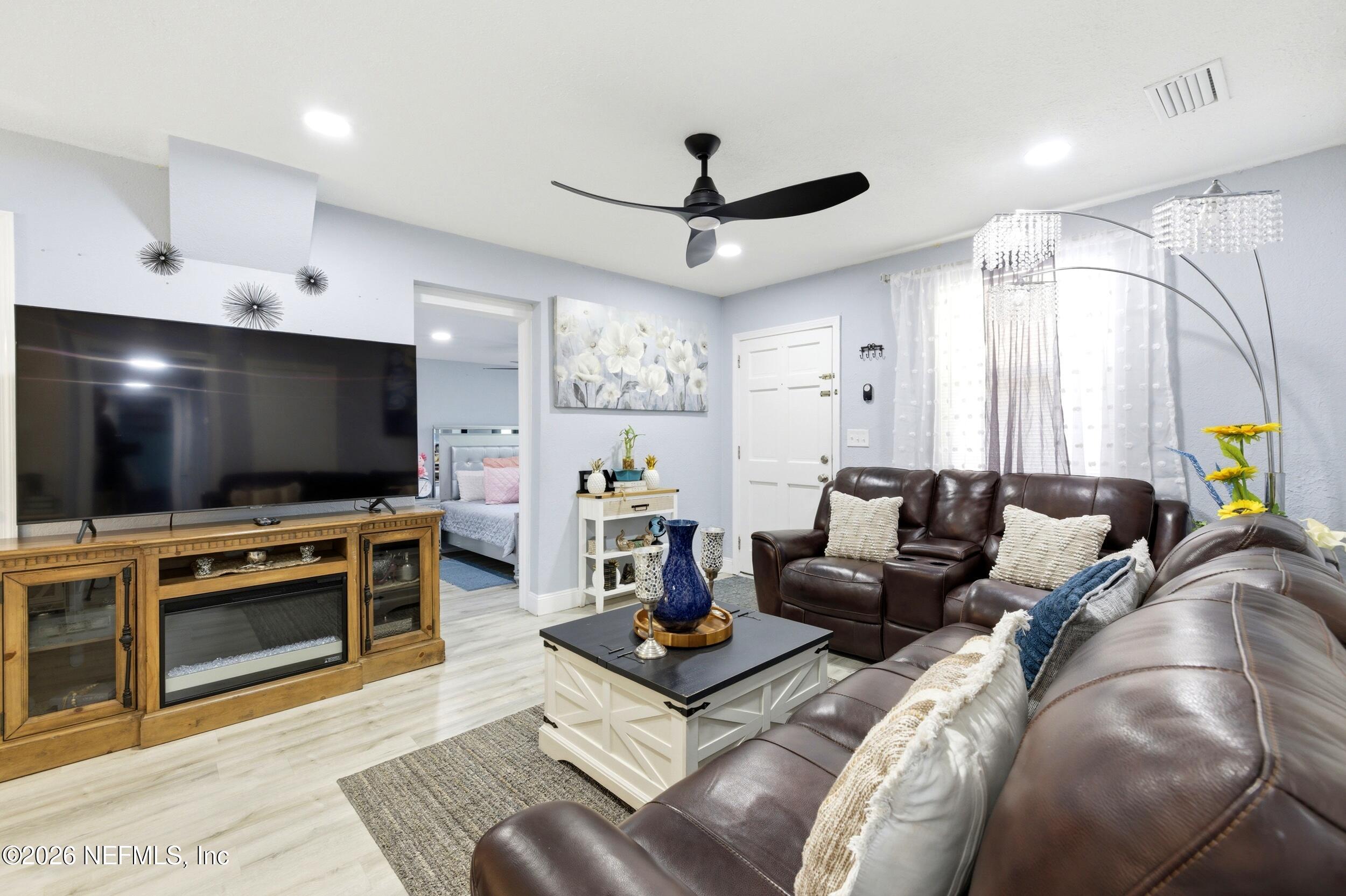 1955 Layton Road Jacksonville, FL 32211 - Photo 9 of 35 a living room with furniture and a flat screen tv