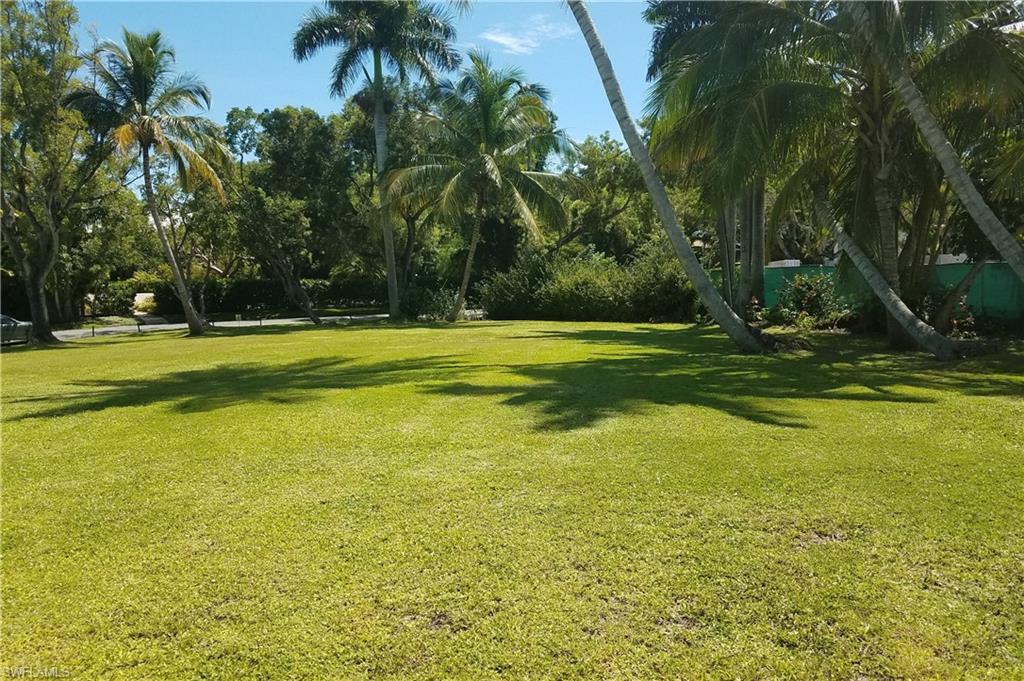 930 18th Avenue South Naples, FL 34102 - Photo 12 of 16 a view of a swimming pool and a yard