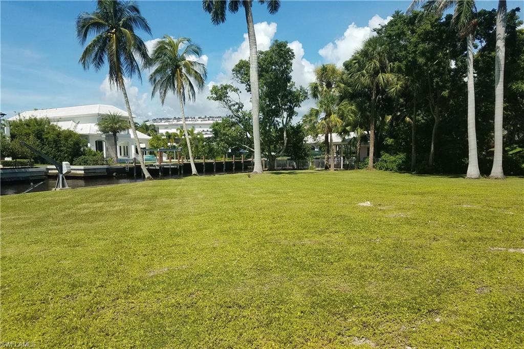 930 18th Avenue South Naples, FL 34102 - Photo 13 of 16 a view of a swimming pool and a yard