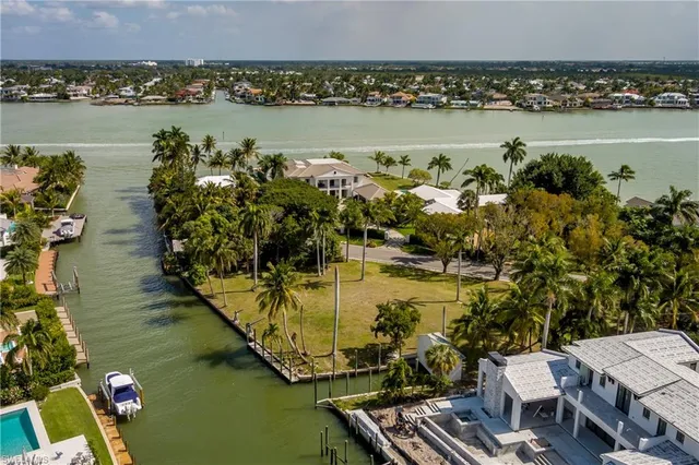 an aerial view of a house with a lake view