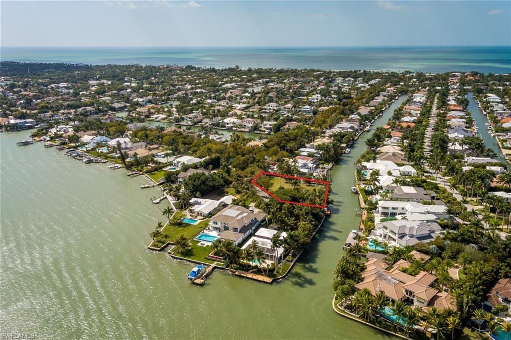 930 18th Avenue South Naples, FL 34102 - Photo 7 of 16 an aerial view of residential houses with outdoor space and lake view