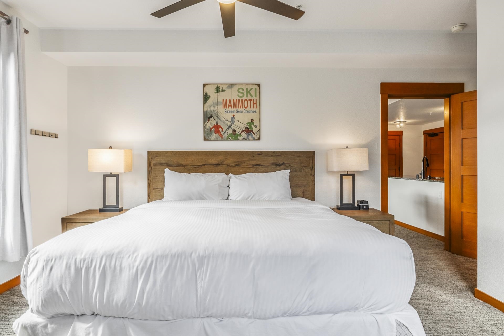 6201 Minaret Road, Unit 2311 Mammoth Lakes, CA 93546 - Photo 14 of 40 a bedroom with a bed and a chandelier