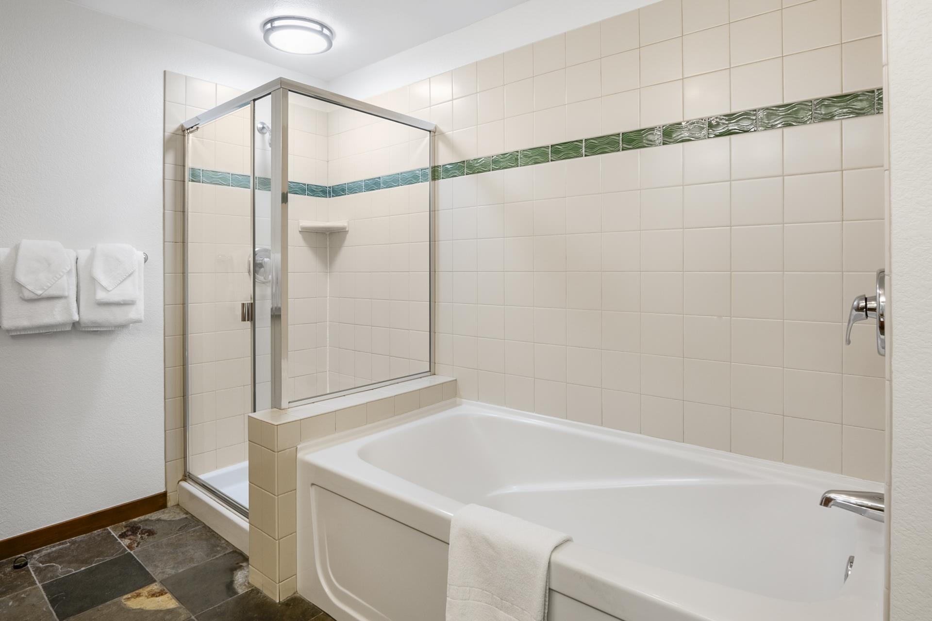 6201 Minaret Road, Unit 2311 Mammoth Lakes, CA 93546 - Photo 17 of 40 a bathroom with a bathtub and a shower