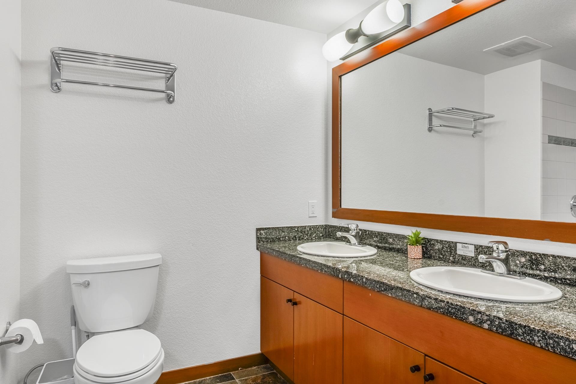 6201 Minaret Road, Unit 2311 Mammoth Lakes, CA 93546 - Photo 23 of 40 a bathroom with a granite countertop sink toilet and shower