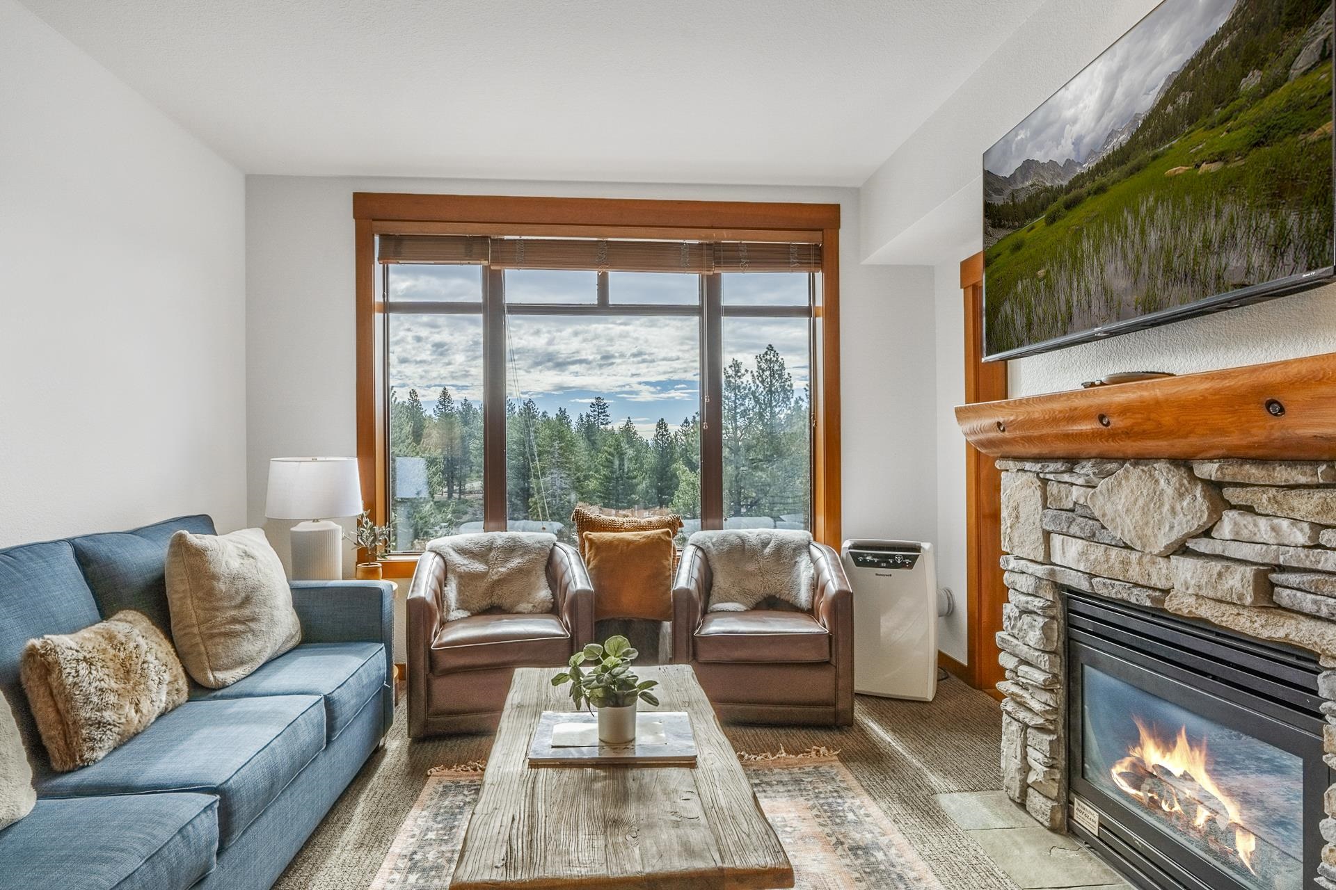 6201 Minaret Road, Unit 2311 Mammoth Lakes, CA 93546 - Photo 3 of 40 a living room with furniture and a fireplace
