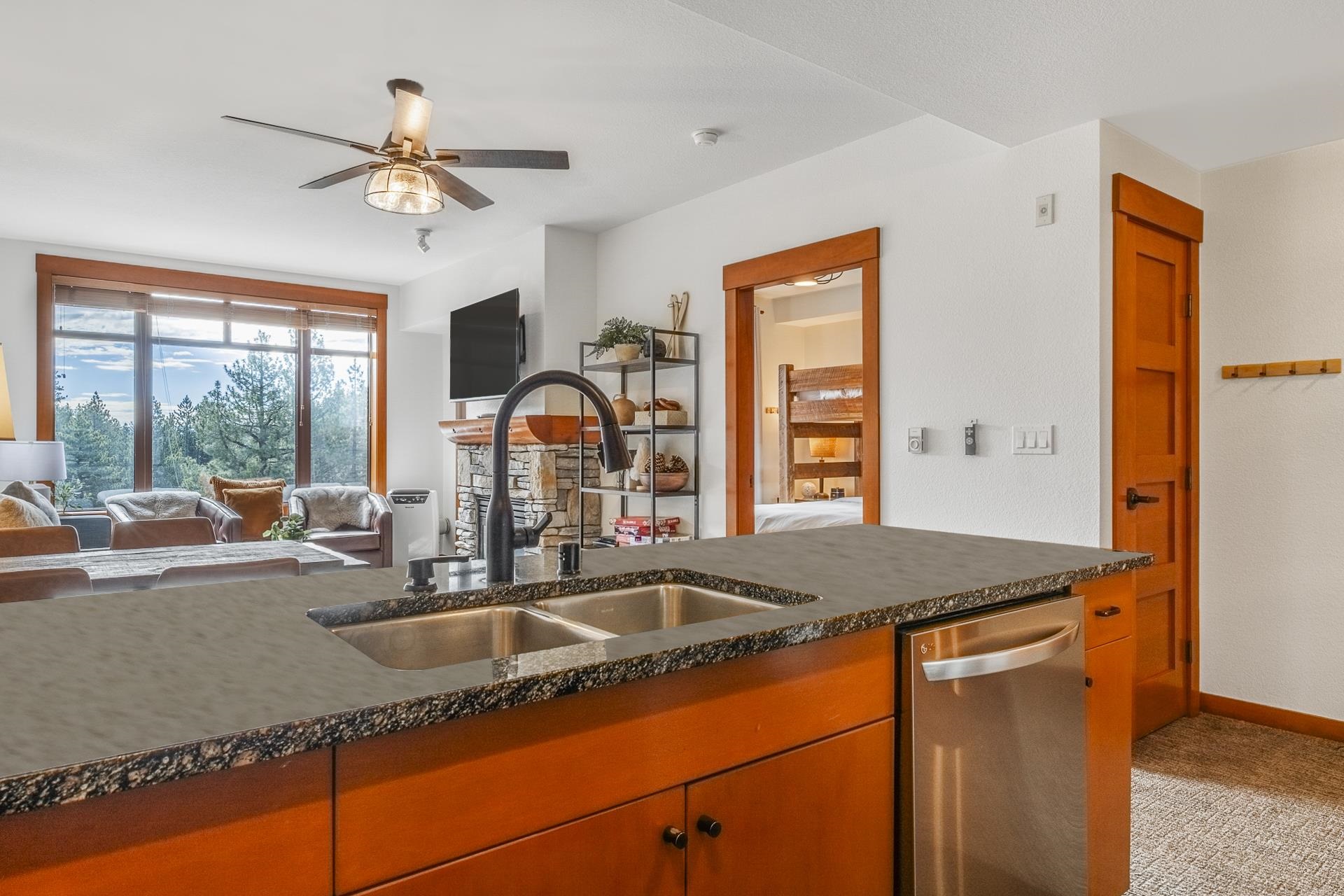 6201 Minaret Road, Unit 2311 Mammoth Lakes, CA 93546 - Photo 6 of 40 a kitchen with granite countertop a sink a counter top space and living room view