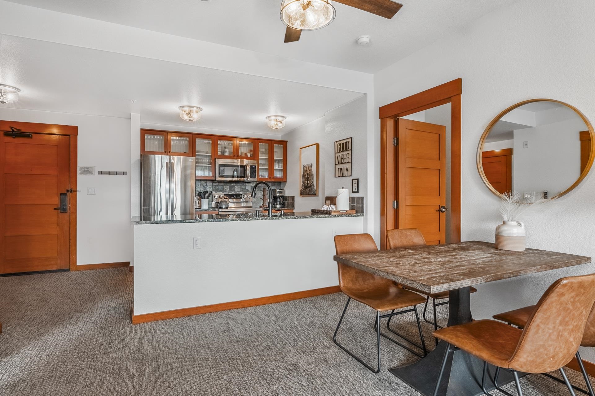 6201 Minaret Road, Unit 2311 Mammoth Lakes, CA 93546 - Photo 9 of 40 a kitchen with a table and chairs