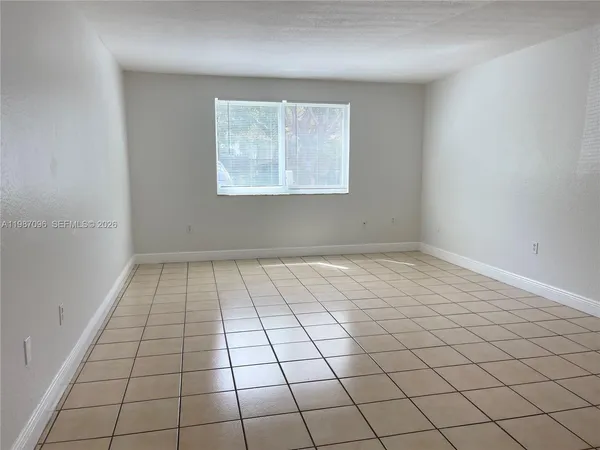 a view of an empty room and window