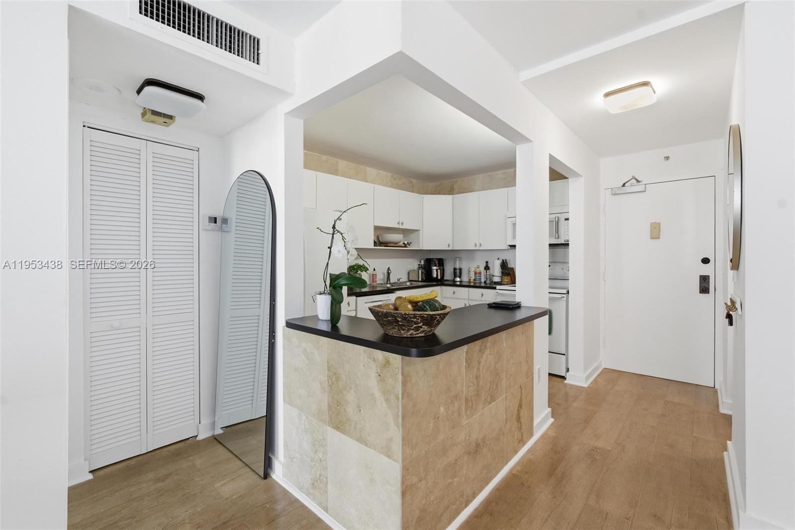 200 Southeast 15th Road, Unit 11H Miami, FL 33129 - Photo 15 of 25 a kitchen with stainless steel appliances granite countertop a refrigerator a stove and a sink